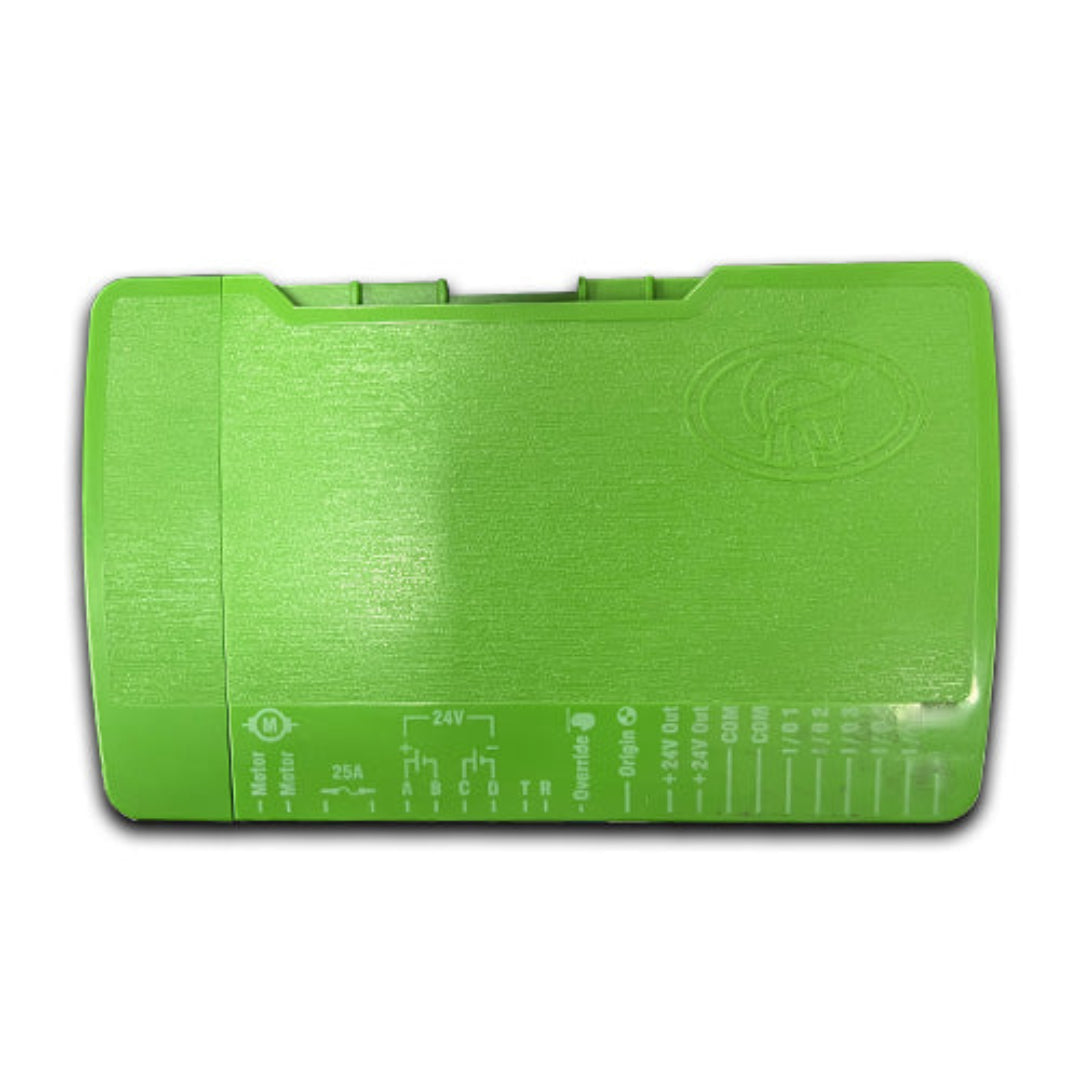 Green plastic tool with measurement markings on a white background