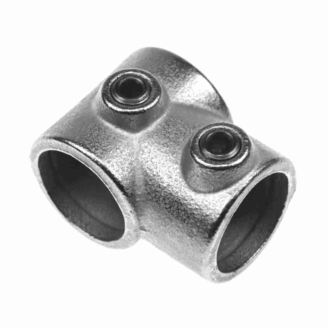 Metal fitting with two cylindrical holes on a white background